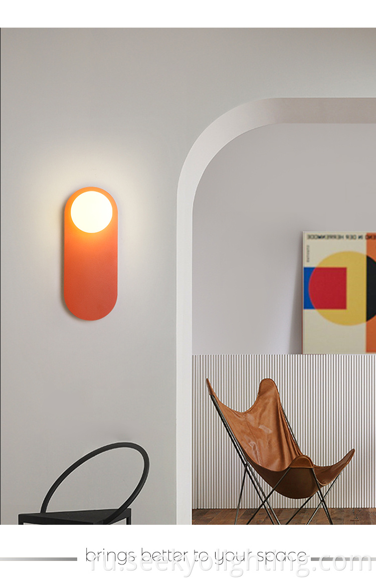 The light features a minimalist design with a bright orange finish that is sure to catch the eye. 